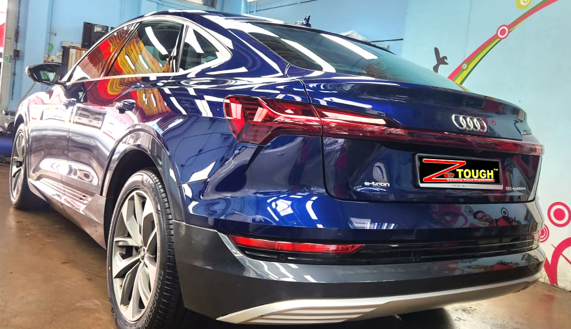 Rear quarter of the Audi e-tron, glossy and protected.