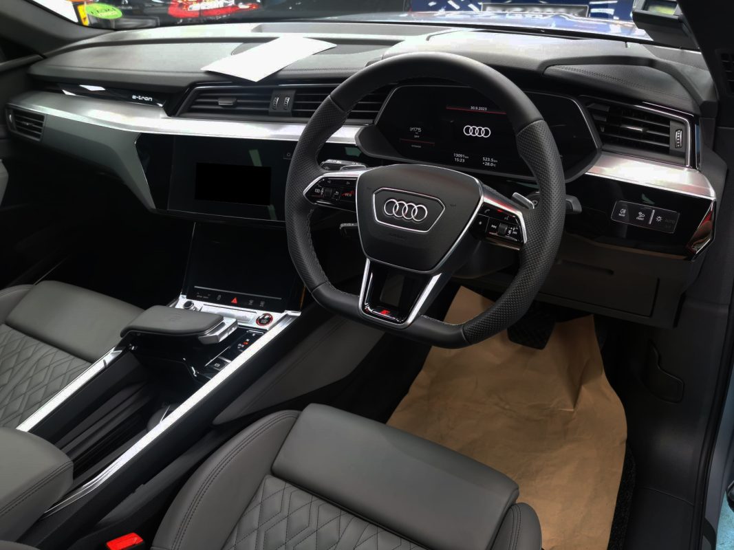 The Audi e-tron parked in the workshop, freshly coated.
