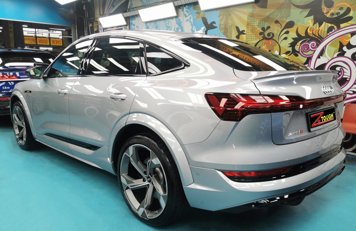 Rear quarter of the Audi e-tron, glossy and protected.