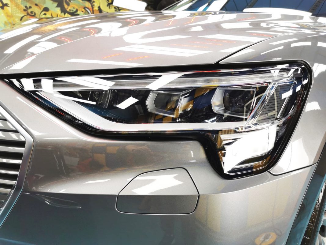 The e-tron's coated paintwork showing clean reflections.