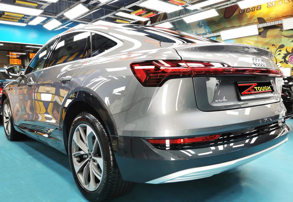 Rear quarter of the Audi e-tron, glossy and protected.