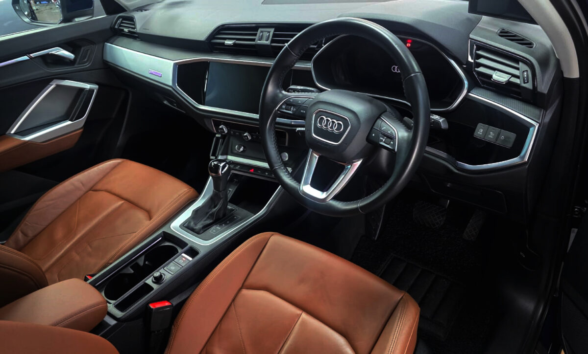 The Audi Q3 parked in the workshop, freshly coated.