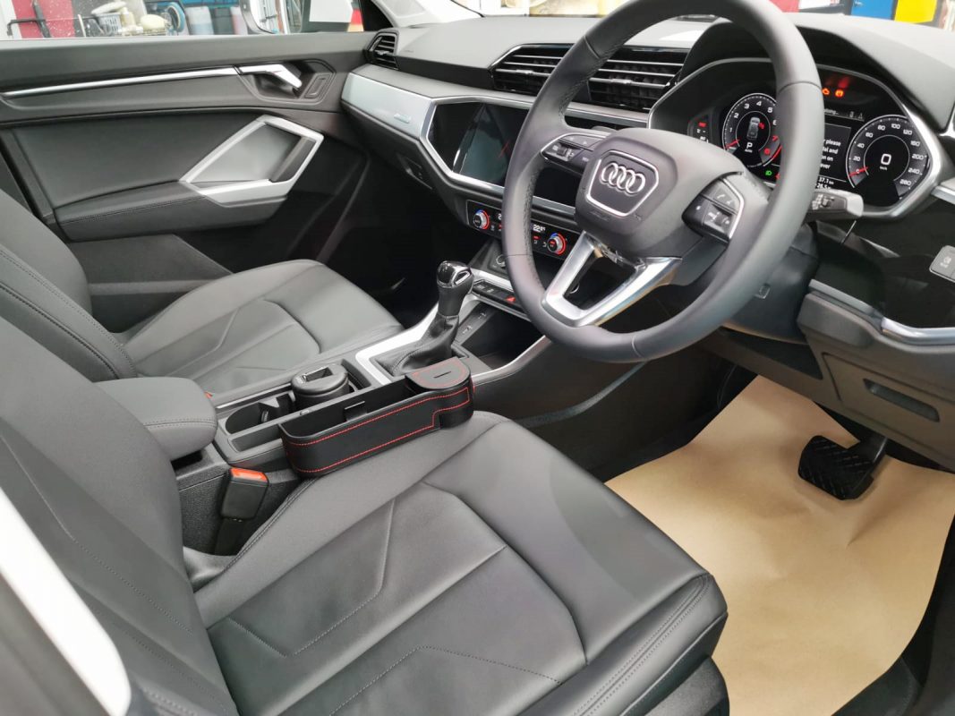 The Audi Q3 parked in the workshop, freshly coated.