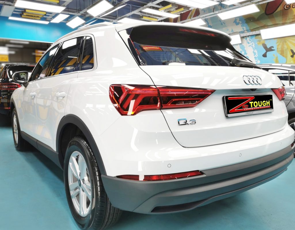 Rear quarter of the Audi Q3, glossy and protected.