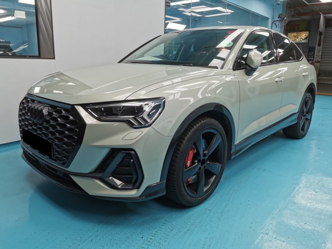 The Audi Q3 as it arrived at Revol Carz, front three-quarter view before the respray.