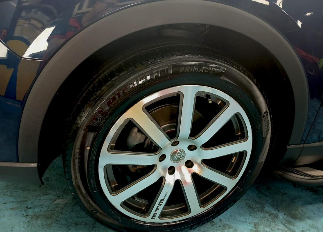 Rear quarter of the Audi Q3, glossy and protected.