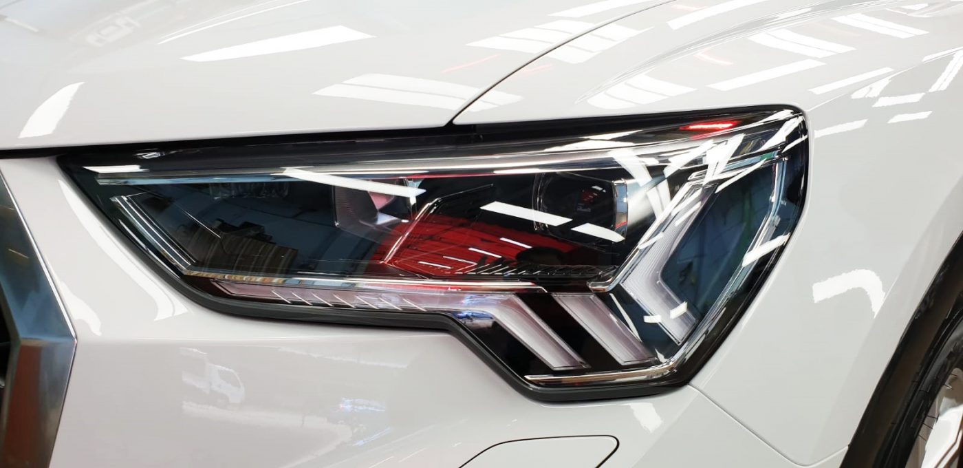 The Q3's coated paintwork showing clean reflections.