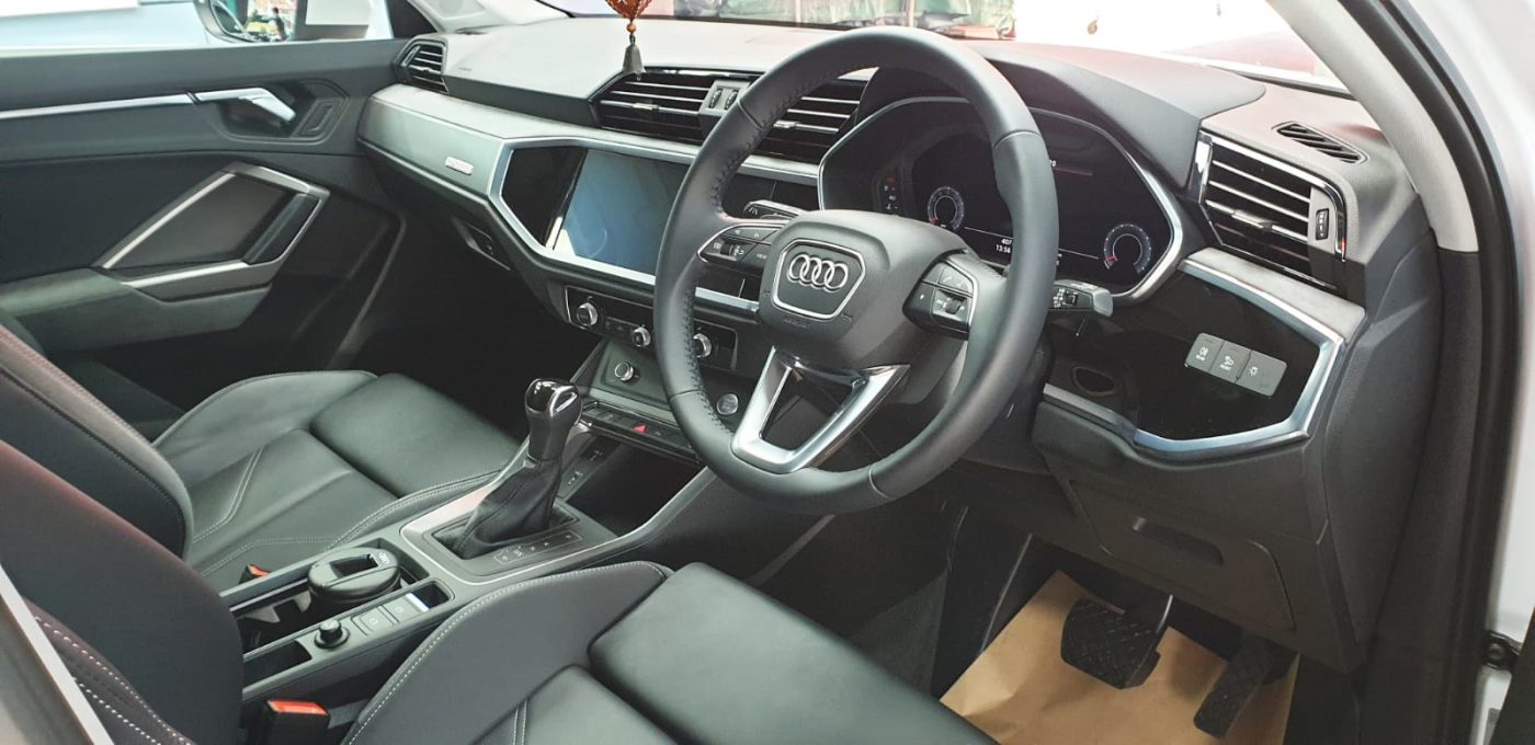 The Audi Q3 parked in the workshop, freshly coated.