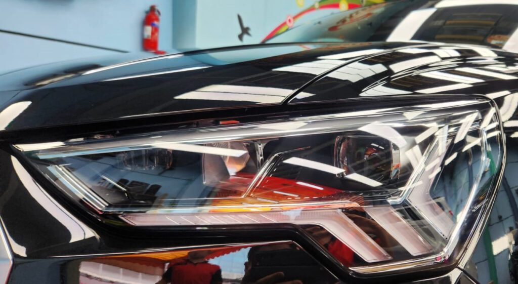 The Q3's coated paintwork showing clean reflections.