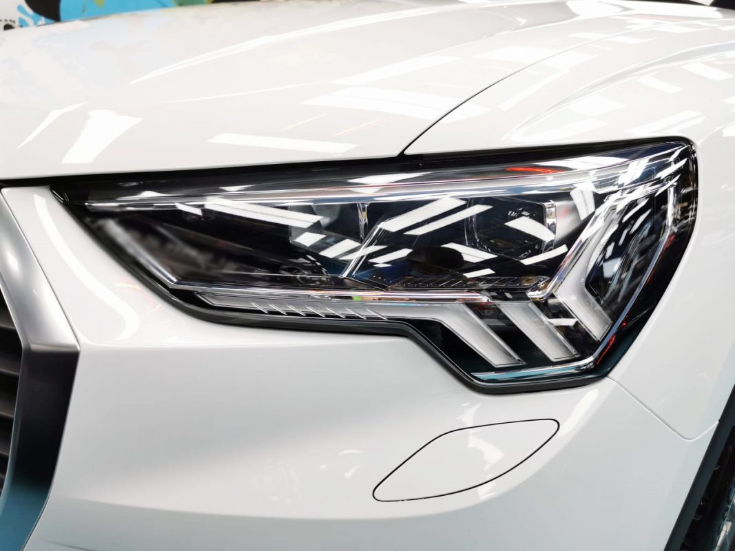The Q3's coated paintwork showing clean reflections.