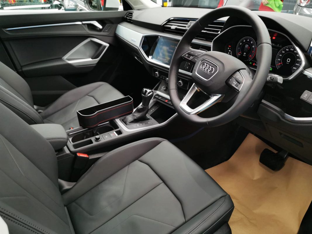 The Audi Q3 parked in the workshop, freshly coated.