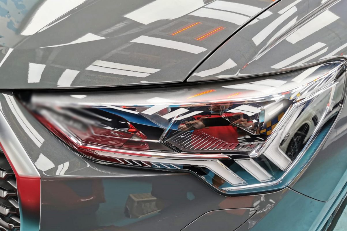 The Q3 Sportback's coated paintwork showing clean reflections.