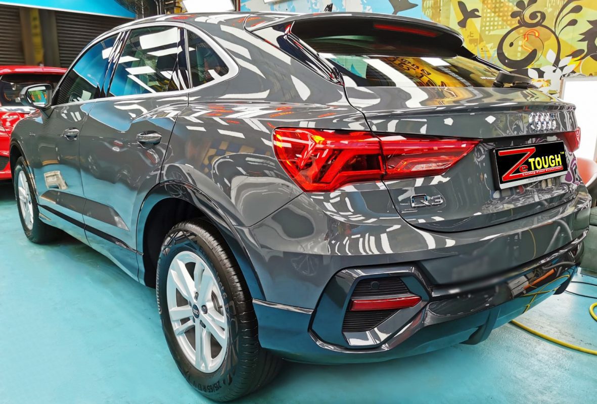 Rear quarter of the Audi Q3 Sportback, glossy and protected.