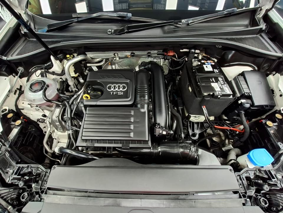 Clean engine bay of the Audi Q3 with the TFSI engine cover.