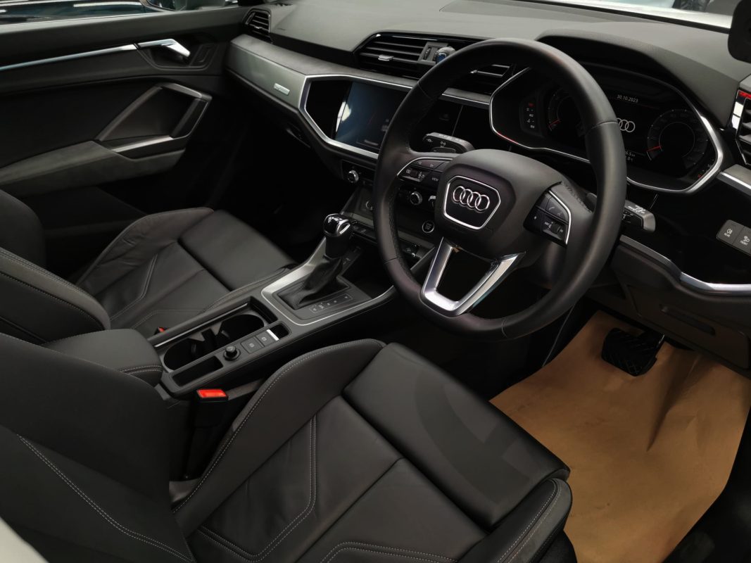 The Audi Q3 parked in the workshop, freshly coated.