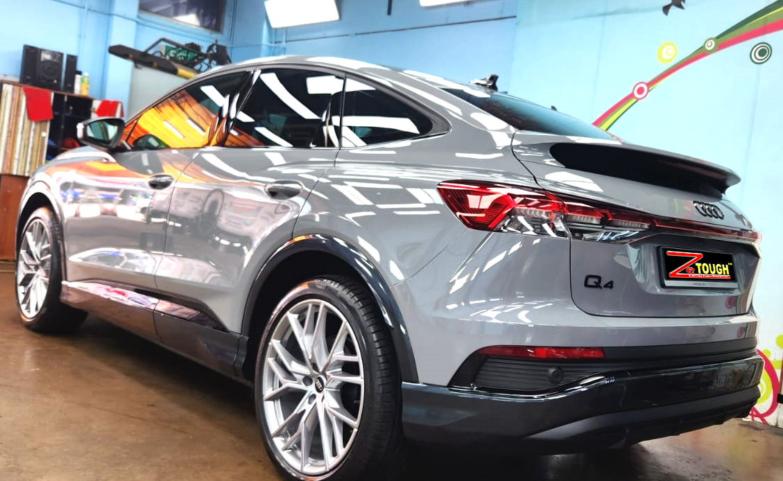 Rear quarter of the Audi Q4, glossy and protected.