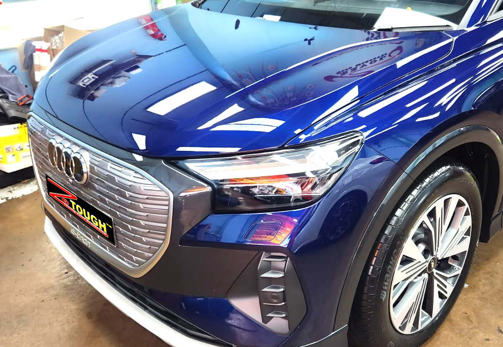 The Audi Q4 from a side angle after the ceramic coating.