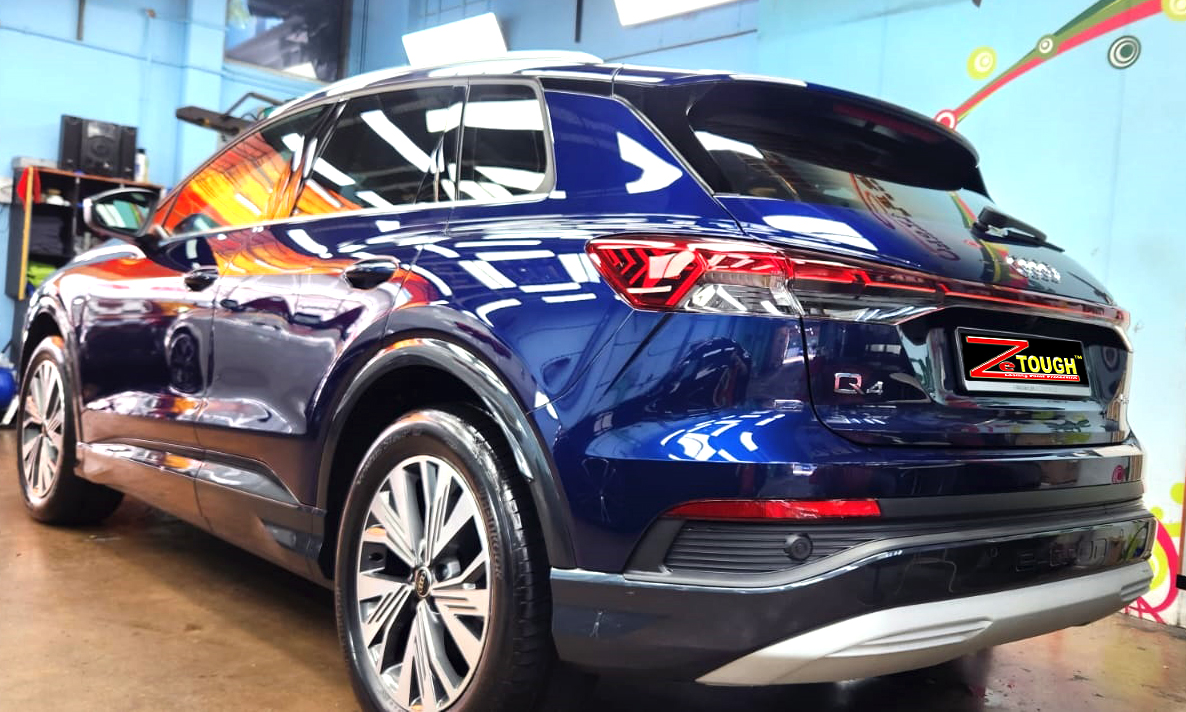 Rear quarter of the Audi Q4, glossy and protected.