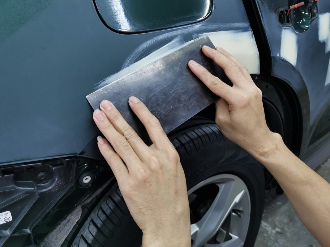 Imperfections on the Q5's body being repaired and patched.