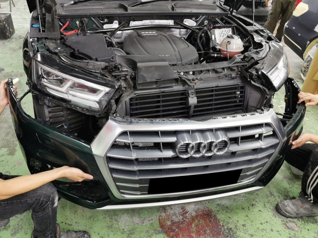 Buffing the new paint on the Q5 to bring up the shine.