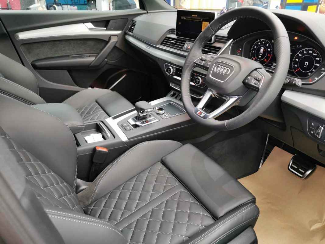 The Audi Q5 parked in the workshop, freshly coated.