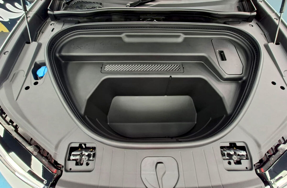 Reflections across the coated panels of the Audi Q6 e-tron.
