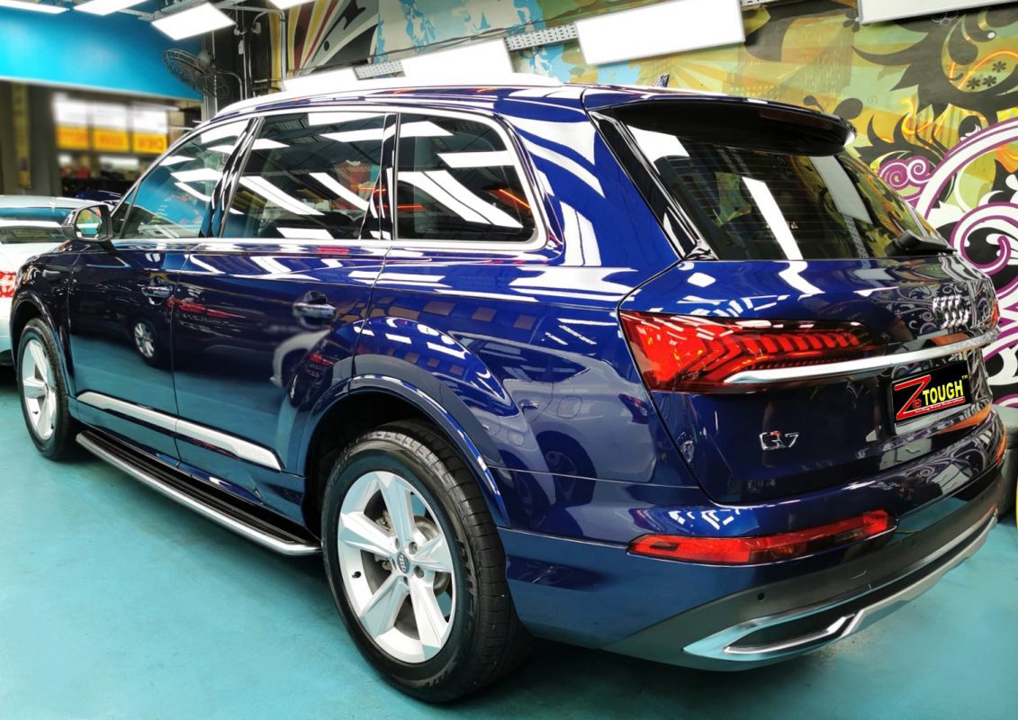 Rear quarter of the Audi Q7, glossy and protected.