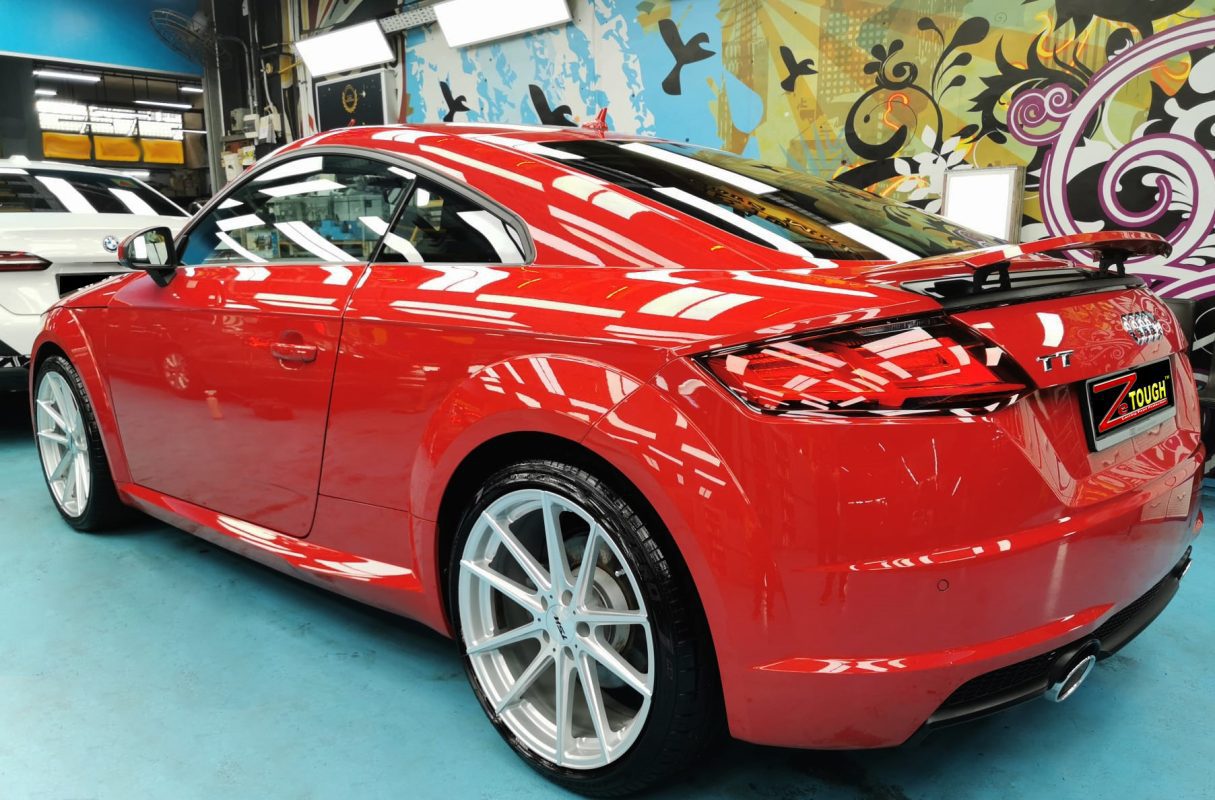 Rear quarter of the Audi TT Coupe, glossy and protected.