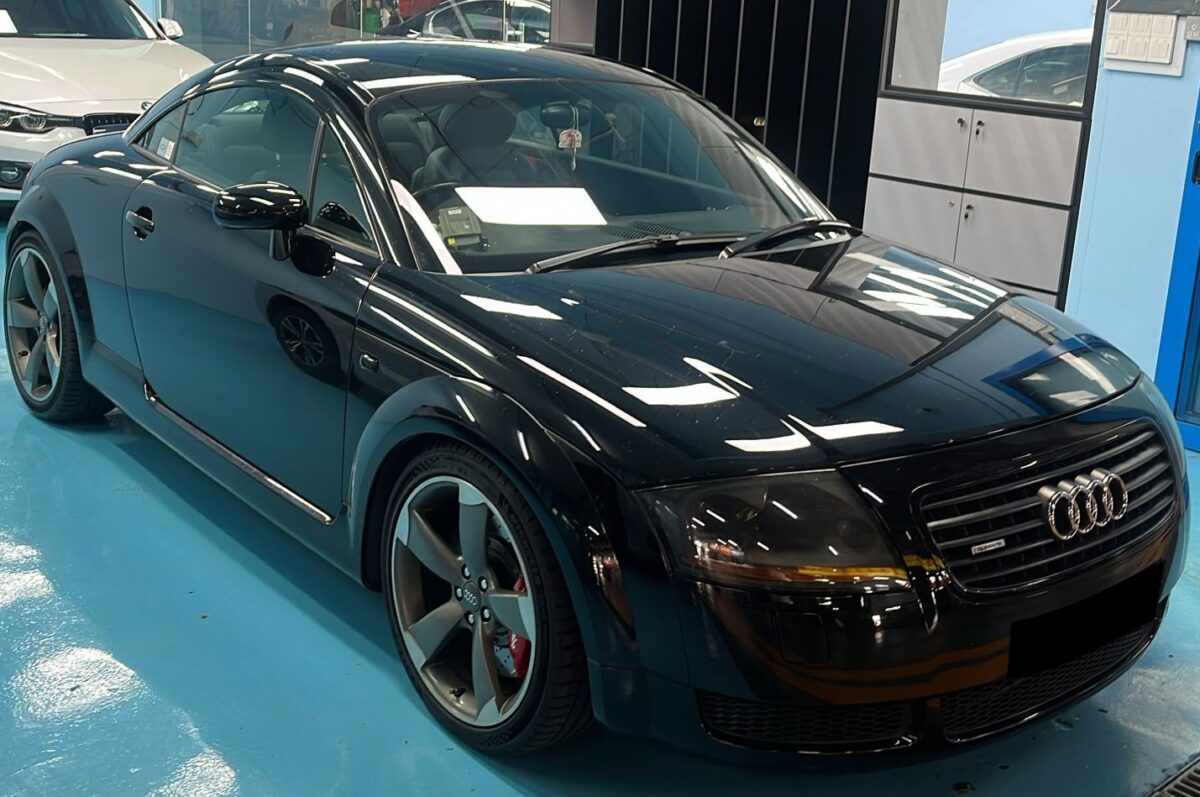 The black Audi TT as it arrived at Revol Carz, rear three-quarter view before the respray.