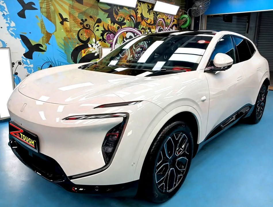 Light grey Avatr 07 front three-quarter view in the Revol Carz workshop after ZeTough Titanium coating.