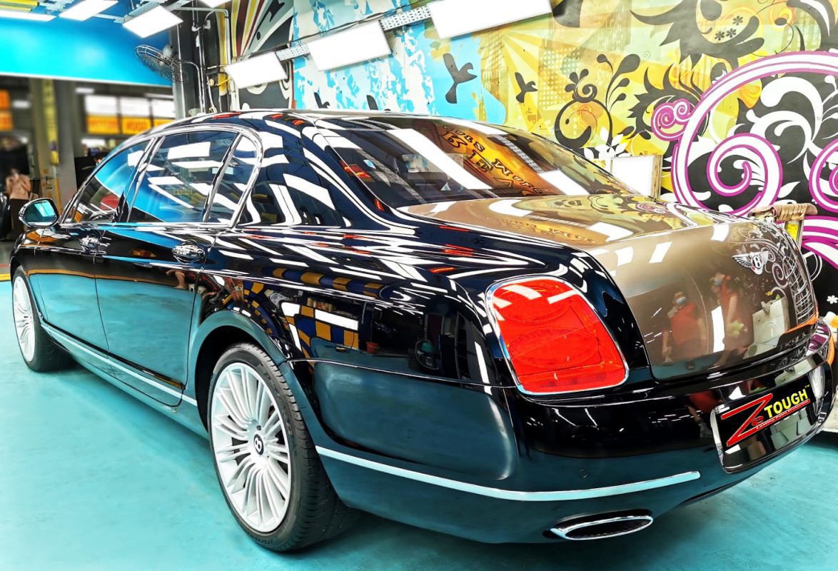 Rear quarter of the Bentley Continental, glossy and protected.