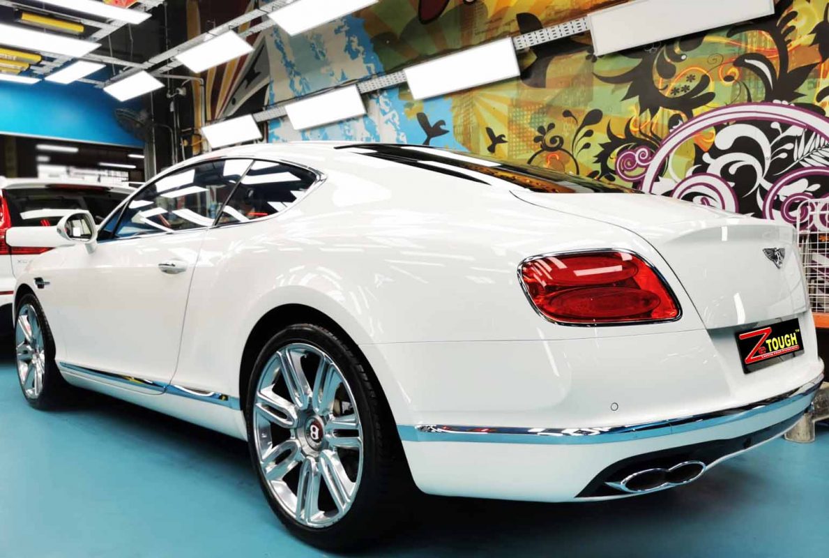 Rear quarter of the Bentley Continental, glossy and protected.