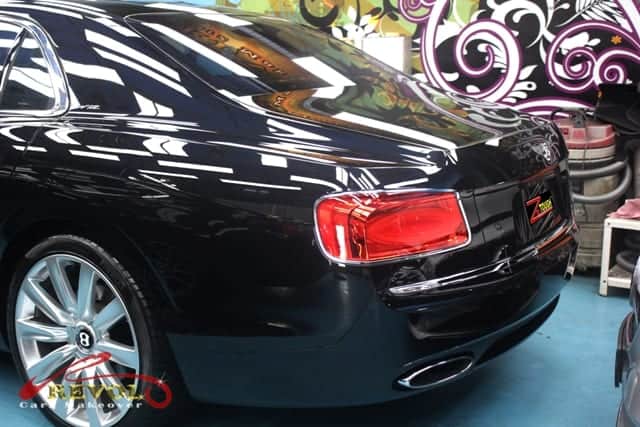Rear quarter of the Bentley Flying Spur, glossy and protected.