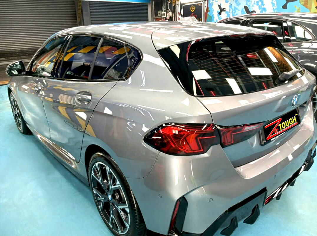 Rear quarter of the BMW 1 Series, glossy and protected.