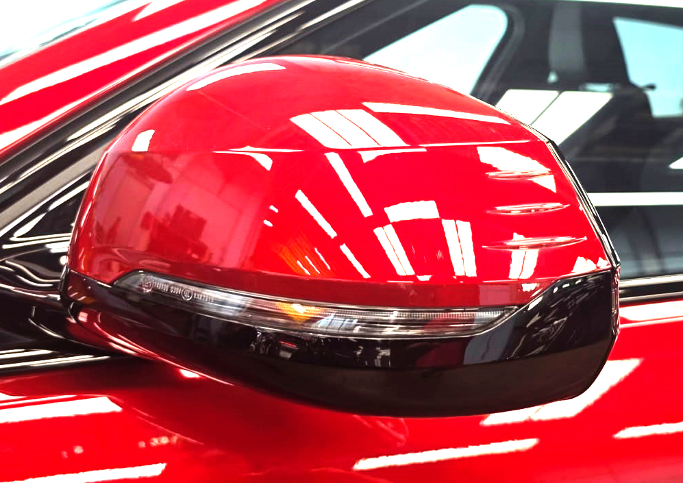 The BMW 1 Series parked in the workshop, freshly coated.