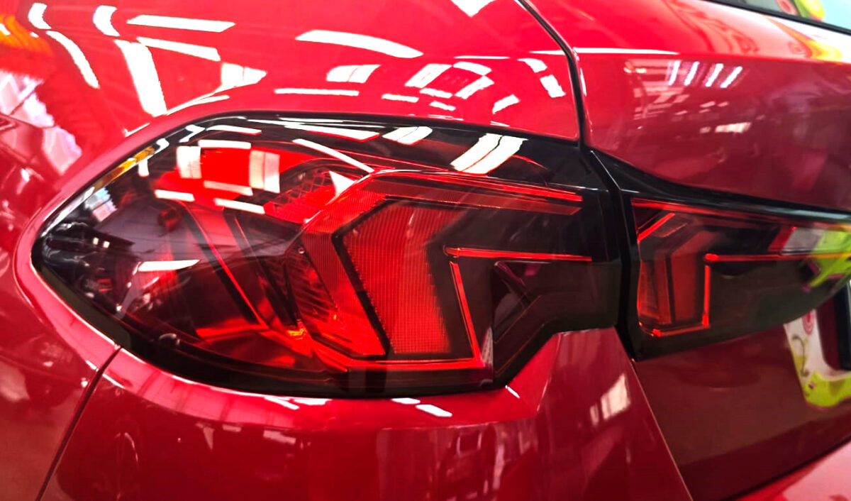 Rear quarter of the BMW 1 Series, glossy and protected.
