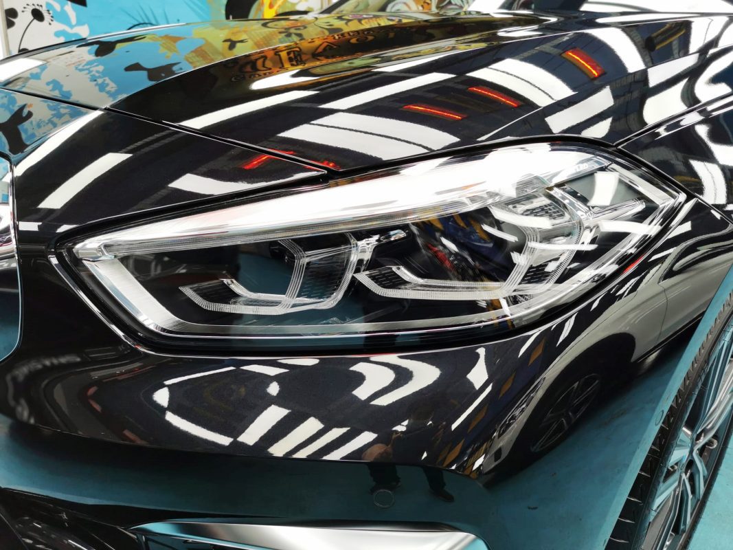 The 1 Series' coated paintwork showing clean reflections.