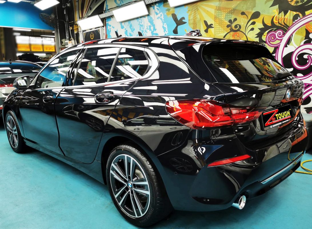 Rear quarter of the BMW 1 Series, glossy and protected.