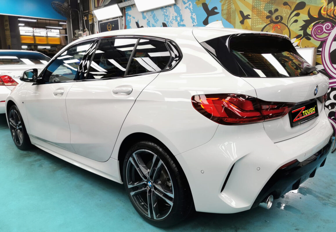 Rear quarter of the BMW 1 Series, glossy and protected.