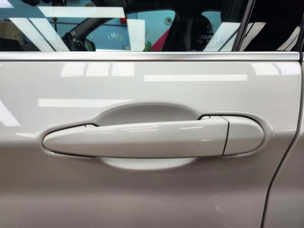 Front three-quarter view of the BMW 116d after coating.