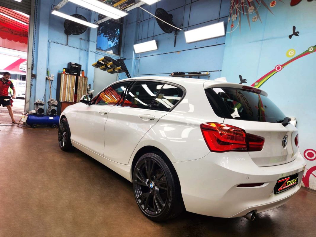 Rear quarter of the BMW 116d, glossy and protected.