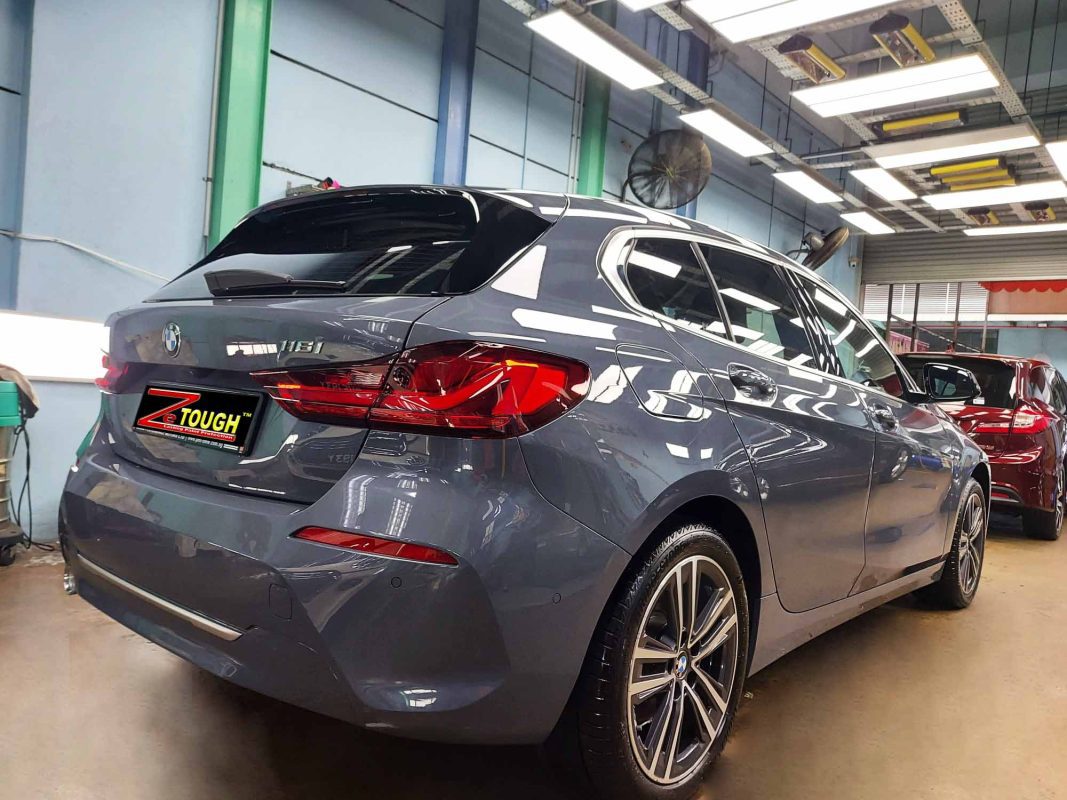 Rear quarter of the BMW 116i, glossy and protected.