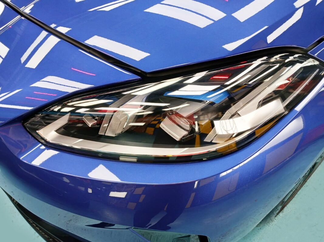 The 116i's coated paintwork showing clean reflections.