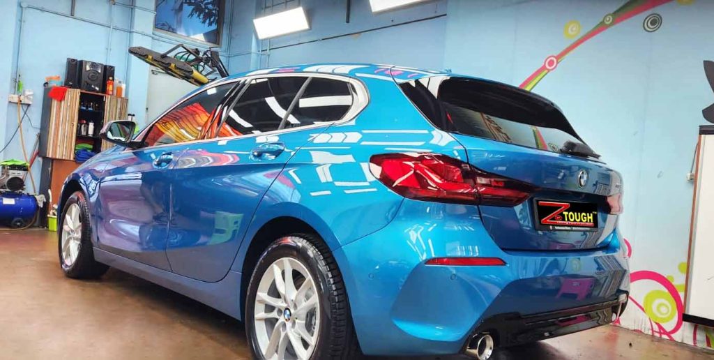 Rear quarter of the BMW 116i, glossy and protected.