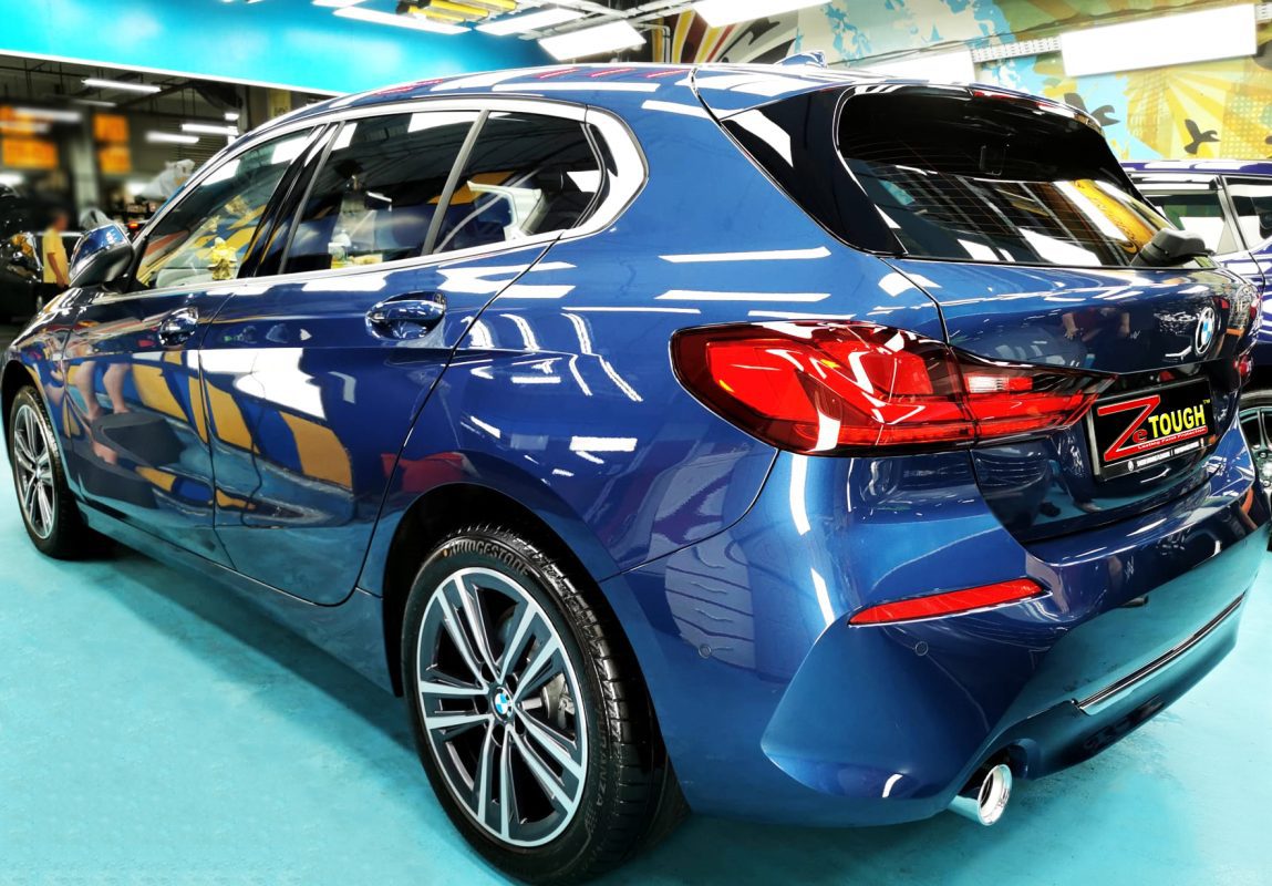 Rear quarter of the BMW 116i, glossy and protected.