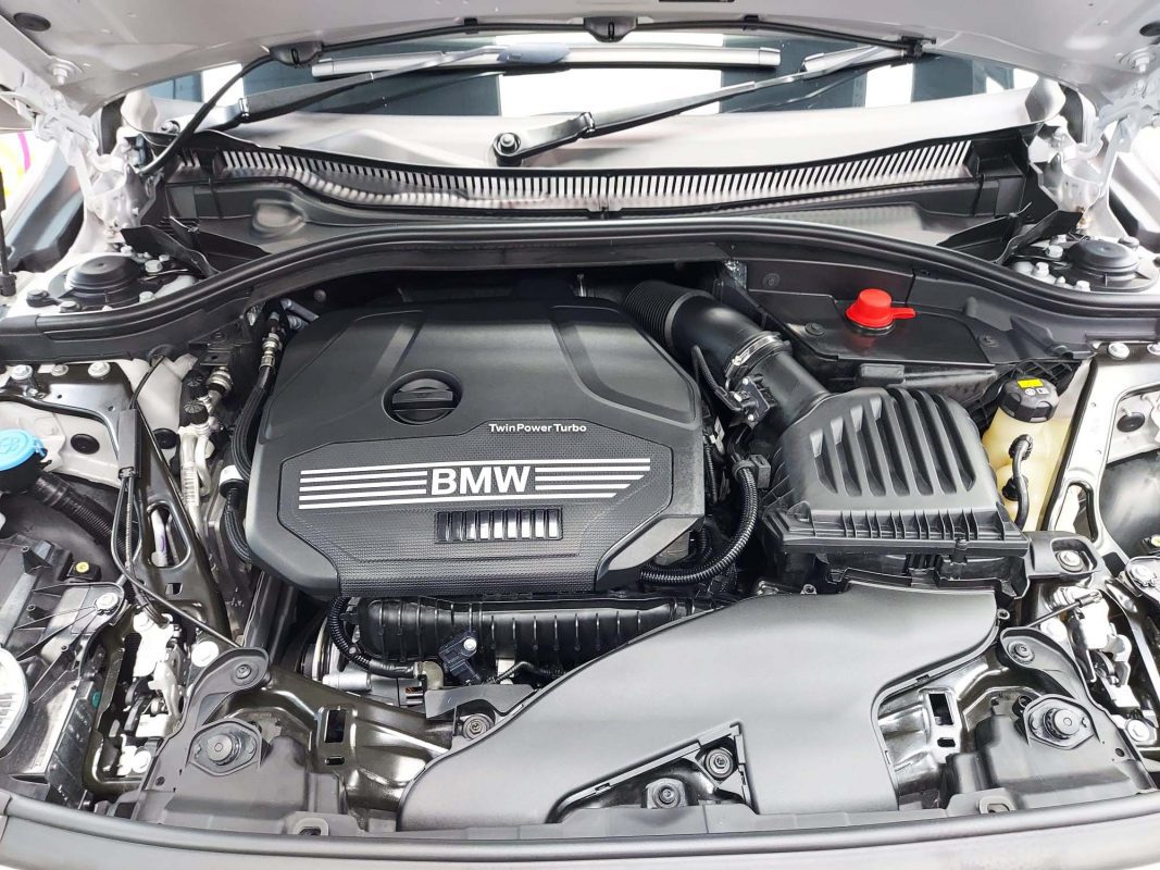 Front three-quarter view of the BMW 118 after coating.
