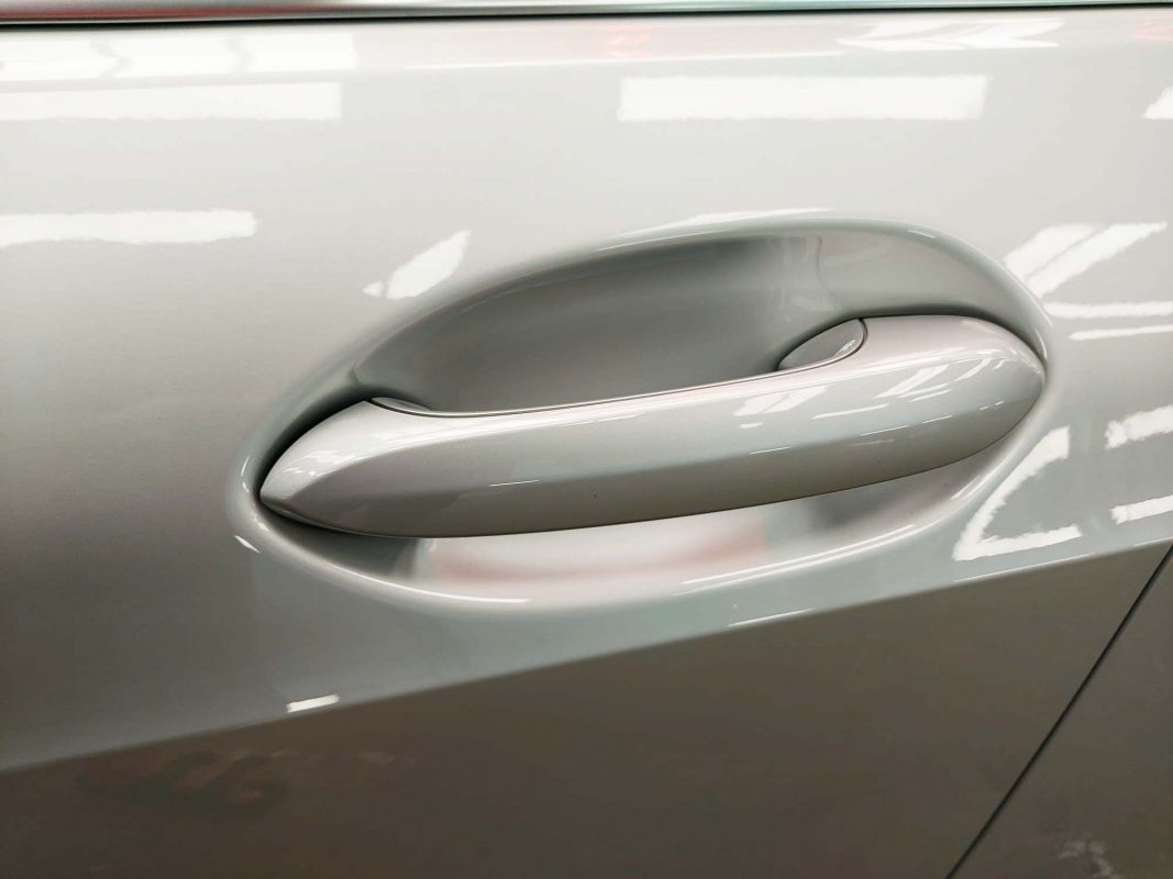 The BMW 118 parked in the workshop, freshly coated.