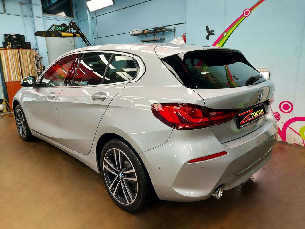 Rear quarter of the BMW 118, glossy and protected.