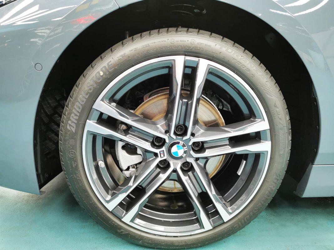 The BMW 118i from a side angle after the titanium coating.