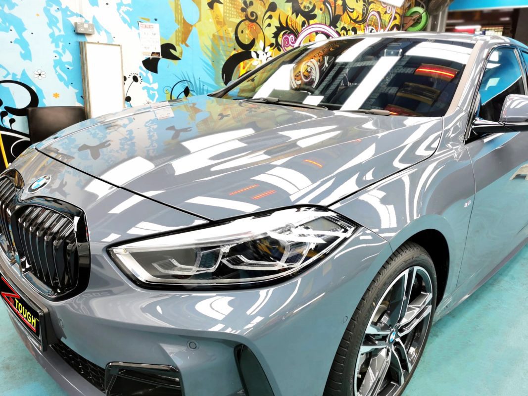 Front three-quarter view of the BMW 118i after coating.